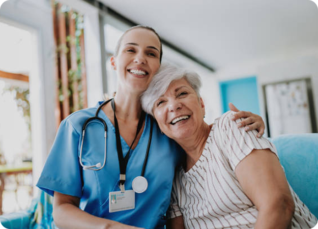 Nurse standing beside an older patient